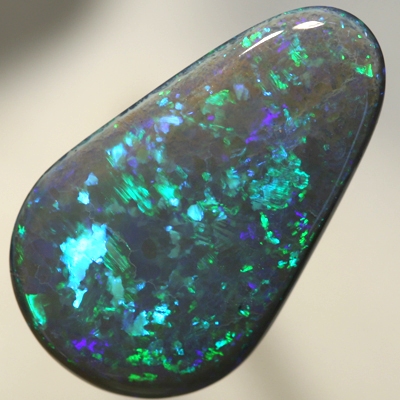 SOLID BLACK OPAL Huge, top quality. With Green and turquoise endlessly sparkling. SEE VIDEO